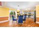 Open dining area with stylish seating, sliding door access to the yard, and a modern, fully-equipped kitchen at 412 Collington Dr, Mebane, NC 27302