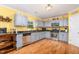 Well-equipped kitchen with stainless steel appliances, granite countertops, ample cabinet space, and hardwood floors at 412 Collington Dr, Mebane, NC 27302