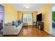 Comfortable living room featuring hardwood floors and a large couch at 412 Collington Dr, Mebane, NC 27302
