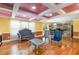 Bright living room with hardwood floors, unique ceiling and stylish furniture near open kitchen at 412 Collington Dr, Mebane, NC 27302