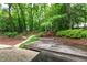 Backyard with multi-level deck and mature trees provides a serene outdoor space at 4213 Oak Park Rd, Raleigh, NC 27612