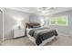 Calming bedroom with a queen-sized bed, neutral tones, and natural light from the window at 4213 Oak Park Rd, Raleigh, NC 27612