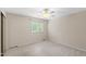 Bright bedroom with carpet and large window offering natural light and neighborhood views at 4213 Oak Park Rd, Raleigh, NC 27612