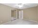 Empty bedroom featuring plush carpeting, a sliding door closet, and neutral colored walls at 4213 Oak Park Rd, Raleigh, NC 27612