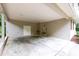 Spacious covered carport with concrete floor and storage area provide convenience and protection at 4213 Oak Park Rd, Raleigh, NC 27612