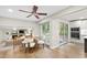 Open concept dining area with a round table, hardwood floors, and views of the backyard at 4213 Oak Park Rd, Raleigh, NC 27612