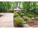 Charming two-story home with landscaped front yard and steps leading to the front door at 4213 Oak Park Rd, Raleigh, NC 27612