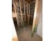 Unfinished basement area with exposed framing and a door at 452 Golden Dragonfly St, Wake Forest, NC 27587