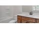 Bathroom featuring wood vanity with white countertop and combined tub and shower at 452 Golden Dragonfly St, Wake Forest, NC 27587