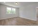 This bedroom has wood flooring, a window, and neutral paint color at 452 Golden Dragonfly St, Wake Forest, NC 27587