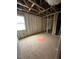 Bedroom under construction with exposed framing, insulation, and a window at 452 Golden Dragonfly St, Wake Forest, NC 27587