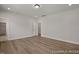 This primary bedroom has neutral paint color, wood flooring, and an ensuite bathroom at 452 Golden Dragonfly St, Wake Forest, NC 27587