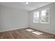 Bedroom with hardwood floors and double window allowing for ample light at 452 Golden Dragonfly St, Wake Forest, NC 27587