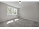 Bedroom with neutral carpet, recessed lighting, and window views of the backyard at 452 Golden Dragonfly St, Wake Forest, NC 27587