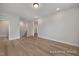 This bonus room has neutral paint color, wood flooring, and stairs to the second floor at 452 Golden Dragonfly St, Wake Forest, NC 27587