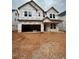 New two-story home with a two-car garage awaiting exterior finishing at 452 Golden Dragonfly St, Wake Forest, NC 27587