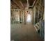 Unfinished hallway with exposed beams and a staircase at 452 Golden Dragonfly St, Wake Forest, NC 27587