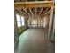 Open-concept unfinished interior featuring framed walls and abundant natural light at 452 Golden Dragonfly St, Wake Forest, NC 27587