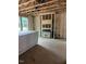 View of the unfinished living room framework, showing insulation and window placement at 452 Golden Dragonfly St, Wake Forest, NC 27587