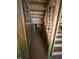A view of a stairway in the construction phase, with visible framing and natural light at 452 Golden Dragonfly St, Wake Forest, NC 27587