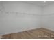 Walk-in closet with wood flooring and installed shelving at 452 Golden Dragonfly St, Wake Forest, NC 27587