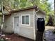 Exterior featuring a door and window with a rain collection system at 501 N Greensboro St, Carrboro, NC 27510
