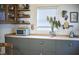 Bright kitchen featuring custom cabinets, stainless appliances, and geometric flooring at 501 N Greensboro St, Carrboro, NC 27510