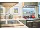 Bright kitchen featuring custom cabinets, stainless steel appliances, and views of the dining room at 501 N Greensboro St, Carrboro, NC 27510
