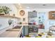 Well-lit kitchen with stainless steel appliances, custom cabinets, and eye-catching geometric flooring at 501 N Greensboro St, Carrboro, NC 27510