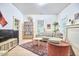 Bright living room featuring a comfortable couch, record collection, and stylish decor at 501 N Greensboro St, Carrboro, NC 27510