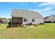 Fenced backyard with a screened in porch, patio and dining set at 518 Spruce Meadows Ln, Willow Springs, NC 27592