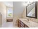 Bright bathroom with natural light and granite countertop at 518 Spruce Meadows Ln, Willow Springs, NC 27592