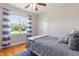 Comfortable bedroom with hardwood floors, natural light and neutral colors at 518 Spruce Meadows Ln, Willow Springs, NC 27592