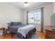 Comfortable bedroom with wood floors, natural light and fan at 518 Spruce Meadows Ln, Willow Springs, NC 27592