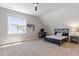 Bright bedroom with natural light, carpeted floors, and an accent wall that enhances the space at 518 Spruce Meadows Ln, Willow Springs, NC 27592