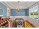 Elegant dining room features a modern chandelier and wainscoting, perfect for hosting gatherings at 518 Spruce Meadows Ln, Willow Springs, NC 27592
