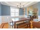 Cozy dining room is adjacent to the living room, creating an ideal space for entertaining guests at 518 Spruce Meadows Ln, Willow Springs, NC 27592