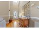 Inviting foyer with hardwood floors, a decorative table, and a stylish front door at 518 Spruce Meadows Ln, Willow Springs, NC 27592