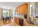 Open kitchen features stainless steel sink, and a view of the breakfast nook for casual Gathering meals at 518 Spruce Meadows Ln, Willow Springs, NC 27592