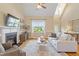 Spacious living room featuring a fireplace, vaulted ceiling, and lots of natural light at 518 Spruce Meadows Ln, Willow Springs, NC 27592