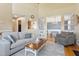 Open-concept living area features hardwood floors and views into the dining room and kitchen areas at 518 Spruce Meadows Ln, Willow Springs, NC 27592
