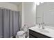 This bathroom includes a shower/tub with a grey shower curtain at 57 S Great White Way, Clayton, NC 27527