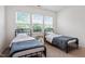 Bedroom featuring twin beds, natural light, and carpeted floors for a cozy and inviting space at 57 S Great White Way, Clayton, NC 27527