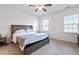Comfortable bedroom featuring natural light, soft carpet and a bed with a headboard for a relaxing atmosphere at 57 S Great White Way, Clayton, NC 27527