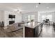 Kitchen with granite countertops, stainless steel appliances and a view to the living room at 57 S Great White Way, Clayton, NC 27527