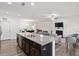 Open concept kitchen with granite countertops, island and view to the living room at 57 S Great White Way, Clayton, NC 27527