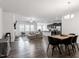 Open concept living area with dining and kitchen offering modern finishes at 57 S Great White Way, Clayton, NC 27527