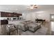 Open-concept living room with stainless steel kitchen appliances and sleek seating at 57 S Great White Way, Clayton, NC 27527