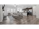 Bright living area with open concept, connected to the kitchen and fireplace at 57 S Great White Way, Clayton, NC 27527