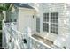Outdoor patio area off back of house with white lattice fencing and rear entry door at 5742 Corbon Crest Ln, Raleigh, NC 27612